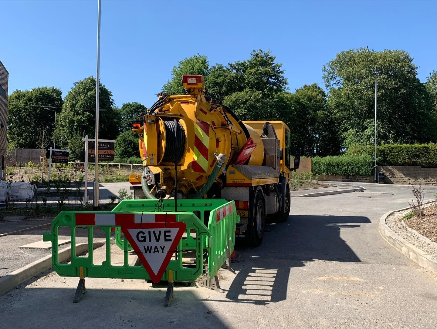 Safety barriers around manholes during survey work