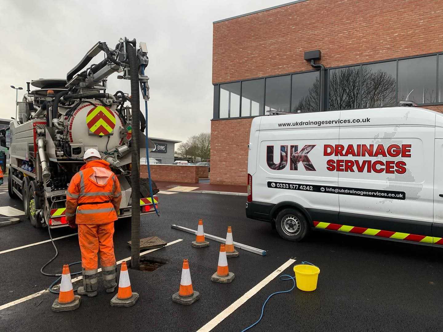 UK Drainage Services team on a commercial construction site