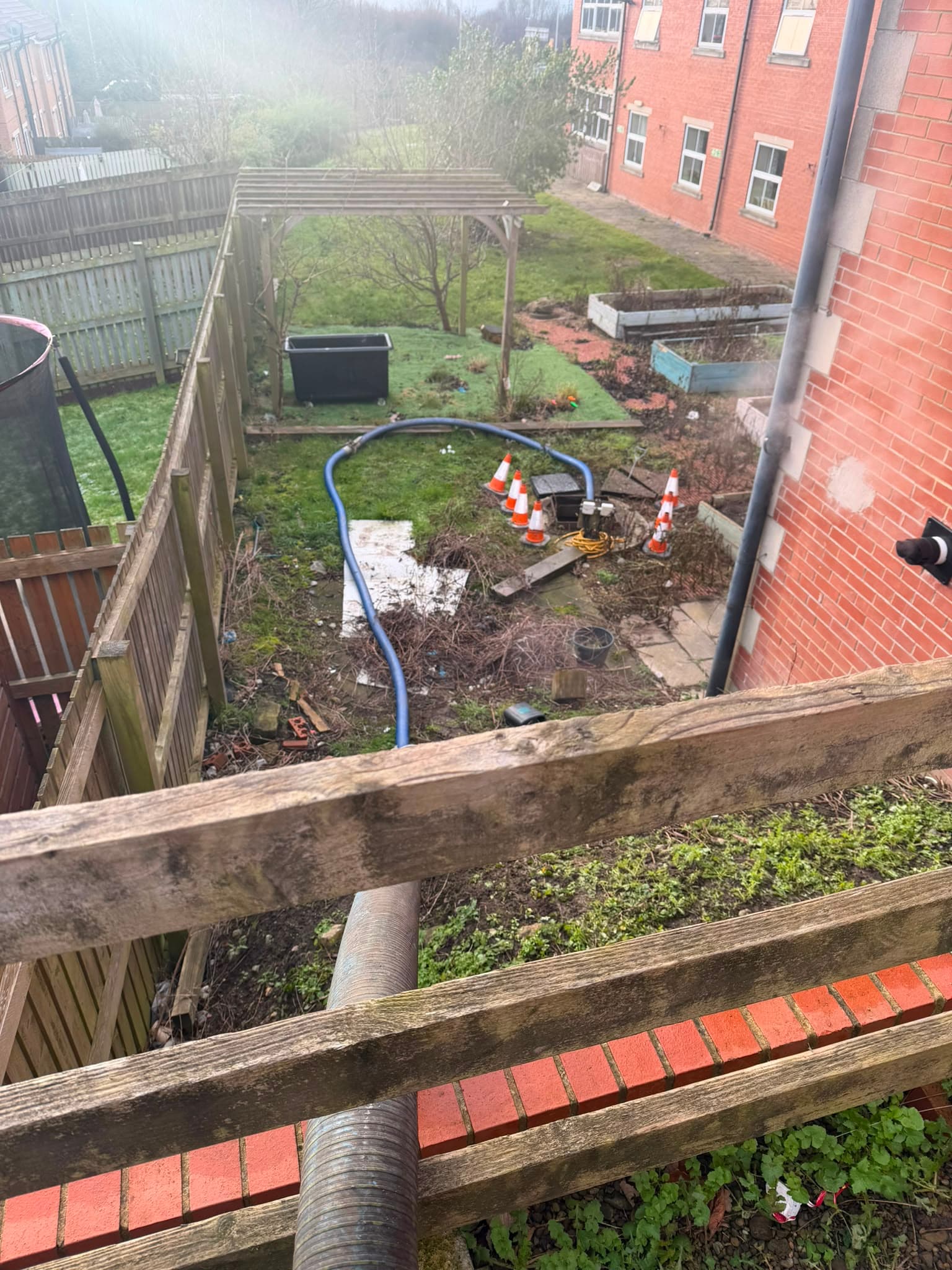 Vacuum tanker hoses run through the care home garden to reach the pumping station