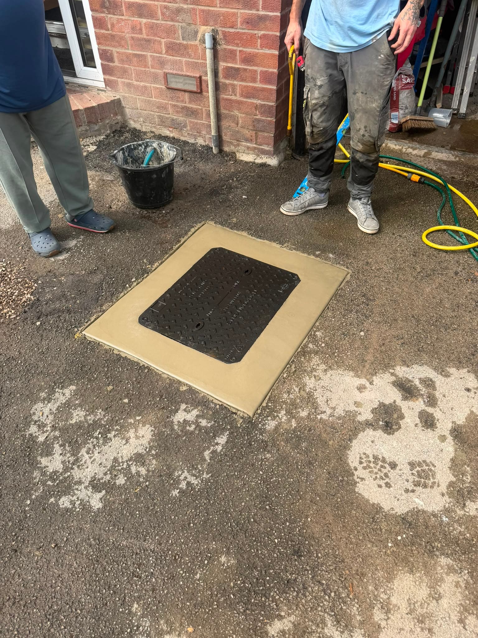 Finished manhole cover replacement in Sheffield, level and ready for vehicle traffic